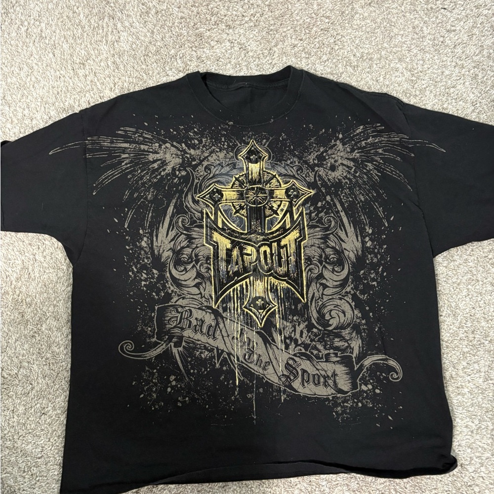 Tapout Black Tee with Gold Cross and Ornamental Graphic